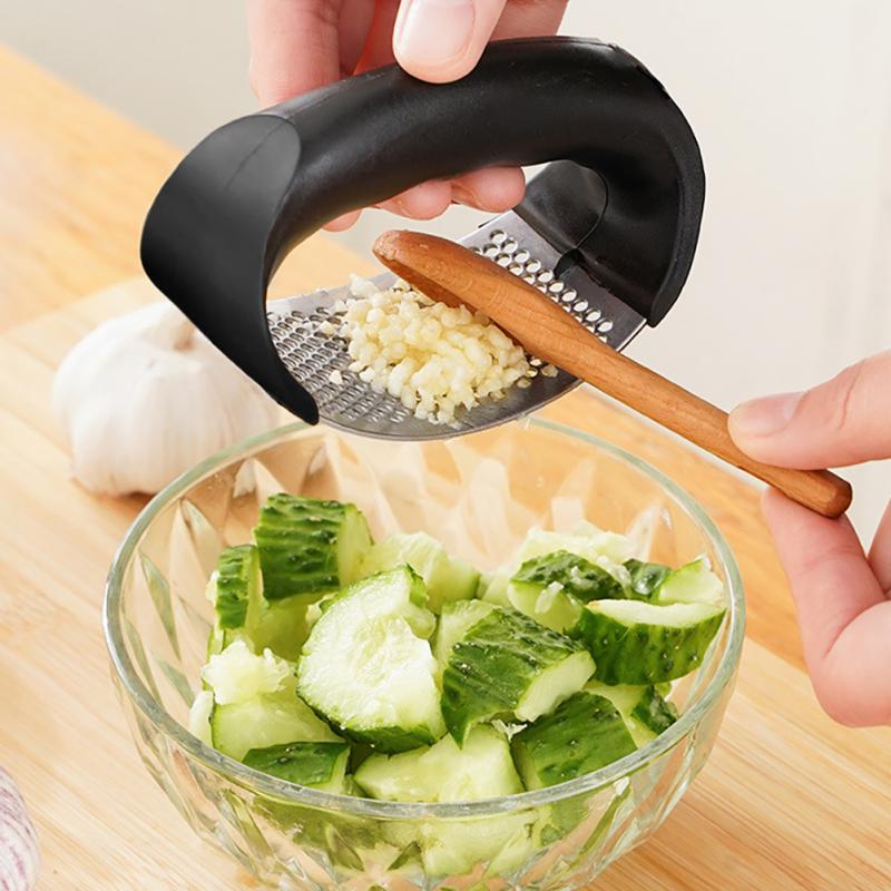 Stainless steel garlic vegetable hand press